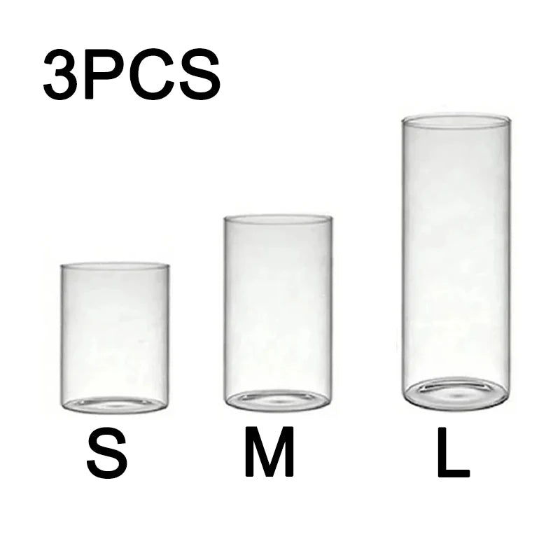 Three clear glass cylindrical candle holders labeled S, M, and L sizes.