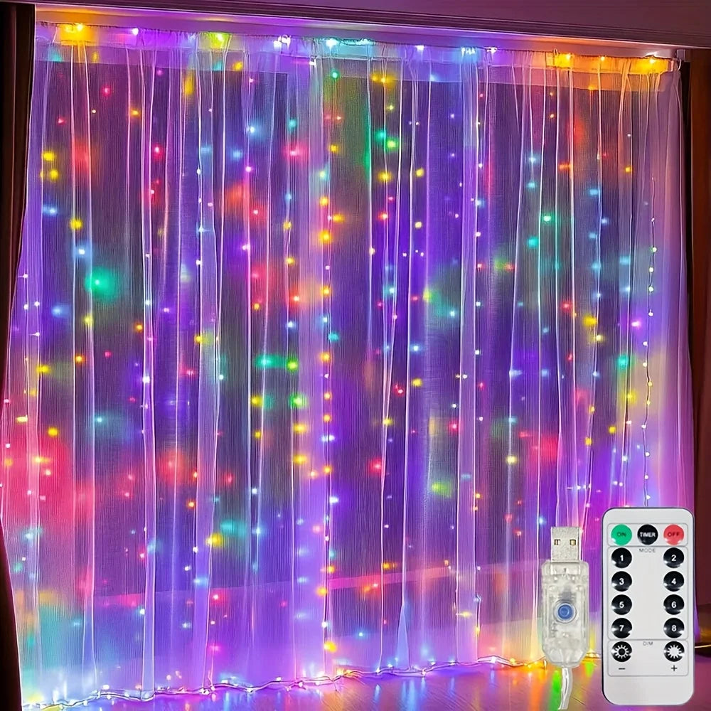 Purple and pink sheer curtain illuminated with vertical fairy lights.