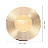 A round, gold-colored vinyl record wall clock with concentric grooves and a central light.