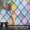 Hand applying non-adhesive glass film with various rainbow colored diamond patterns onto a window surface.
