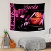 A black tapestry featuring the text Lucki and an image of a woman in a car with pink lighting.