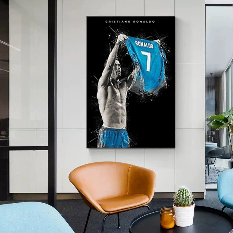 A framed canvas wall art featuring a black and white depiction of Cristiano Ronaldo celebrating with a blue jersey.