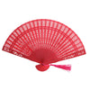 A vibrant red hand carved bamboo folding fan with intricate lattice work.
