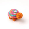 Handmade crocheted turtle plush with colorful patterned shell and orange body