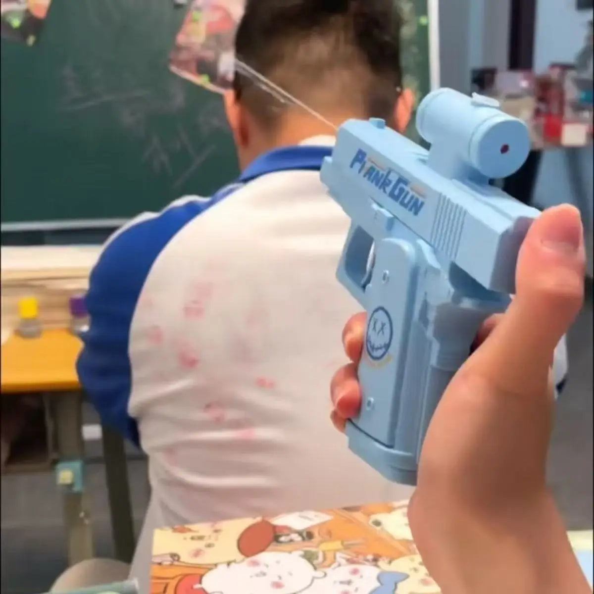 A person holds a light blue reverse spray water gun, demonstrating the product for summer fun.