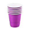 A stack of purple disposable shot glasses with white lids.
