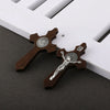 A set of wooden crucifix pendants featuring a figure of Jesus Christ and the inscription INRI.