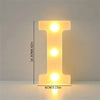 A glowing yellow LED letter light shaped like the letter I, used for room or party decor.