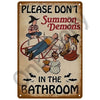 Vintage metal sign warning not to summon demons in the bathroom featuring a silhouette of a person and bats.