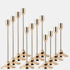 A set of twelve elegant gold metal candle holders with slender stems and flared bases.
