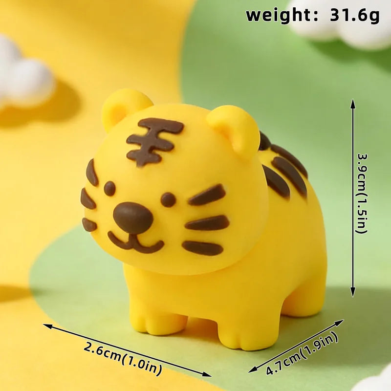 A yellow tiger-shaped cake topper with black stripes, shown against a light green background.