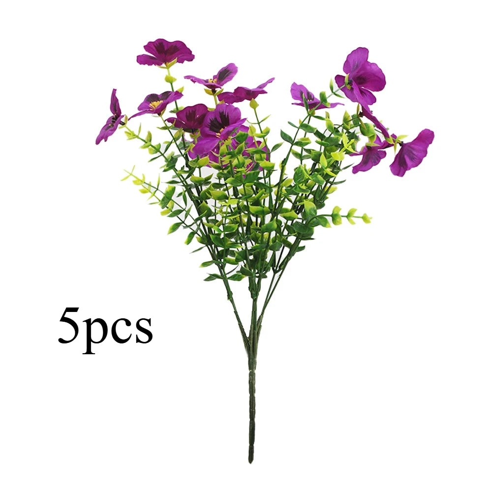 A bouquet of five artificial purple pansy flowers with green leaves on a single stem.