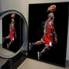 A canvas wall art print depicting a basketball player in a red jersey mid-air against a black background.