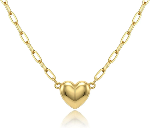 A delicate gold-colored chain necklace featuring a heart pendant with a magnetic clasp.