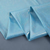 Blue iridescent sequin fabric draped in folds for a photography backdrop