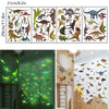 A display of glow-in-the-dark dinosaur wall stickers for kids' rooms, featuring various dinosaurs on a wooden panel.
