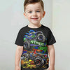 A young boy wearing a black t-shirt featuring a full graphic print of the Monster Jam Grave Digger vehicle.