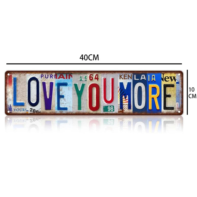 A rectangular vintage metal street sign decor featuring the text LOVE YOU MORE in various colors on a distressed background.