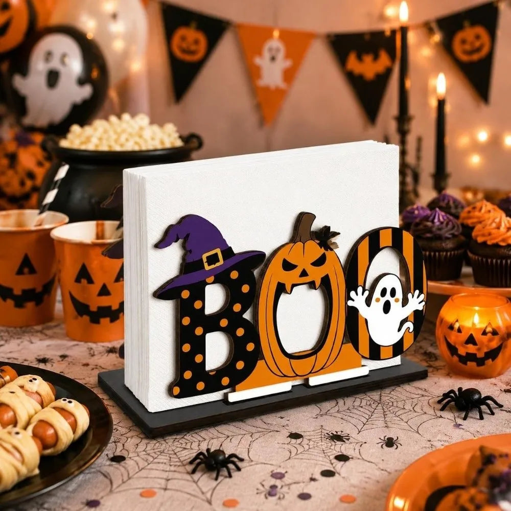 A wooden tissue dispenser featuring a black bat-like design and an orange pumpkin pattern.