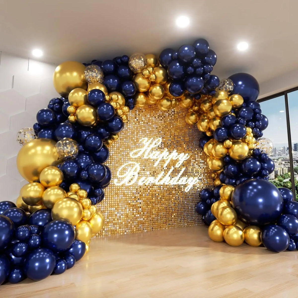 A large balloon arch decorated with gold and navy blue balloons forming an archway backdrop.