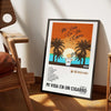 A framed canvas wall art print titled Mi Vida En Un Cigarro featuring palm trees and an orange sunset.
