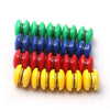 A set of ten colorful refrigerator magnets in shades of green, blue, and red arranged in a row.