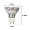 A clear glass adjustable electric candle warmer lamp with a white base and metal stand.