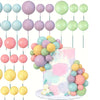 A set of 20 pastel colored ball cake toppers in various shades of pink, green, and blue on thin sticks.