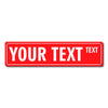 A red rectangular sign with the text YOUR TEXT and a smaller word TEXT on the right.