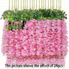 A dense display of pink artificial wisteria vine garland flowers