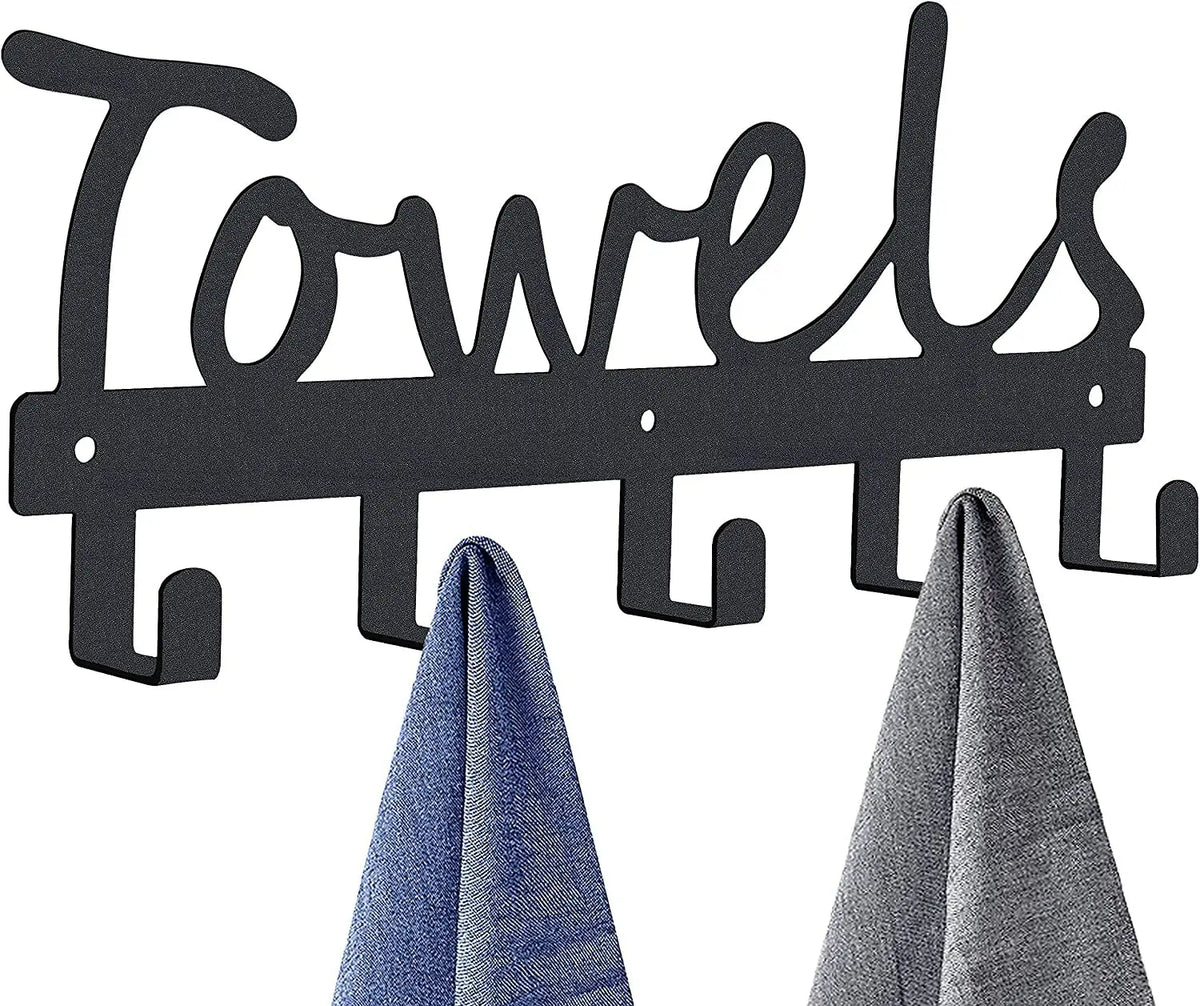 Black decorative metal wall-mounted towel rack with seven hooks displaying folded towels.