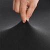A hand is touching the fabric of a black stretch spandex cocktail tablecloth skirt.