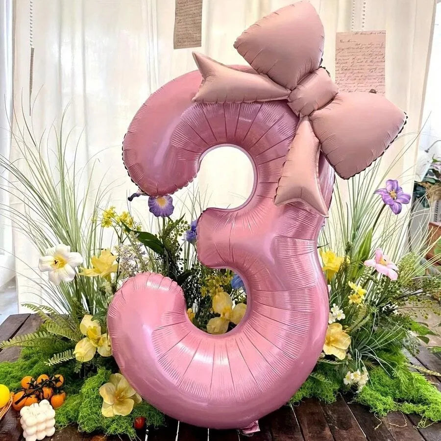 Pink 32-inch number balloon shaped like the number 3 with a matte bow decoration