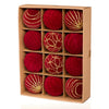 A set of twelve red velvet Christmas hanging ornaments with gold glitter accents displayed in a cardboard box.