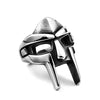 A silver stainless steel mask ring featuring a stylized skull design.