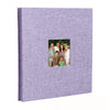 A purple linen front scrapbook memory book with a photo of a family.