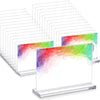 A set of clear acrylic double-sided tabletop sign holders arranged in rows.