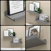 Two rustic floating wood shelves display framed art and greenery on a beige wall.