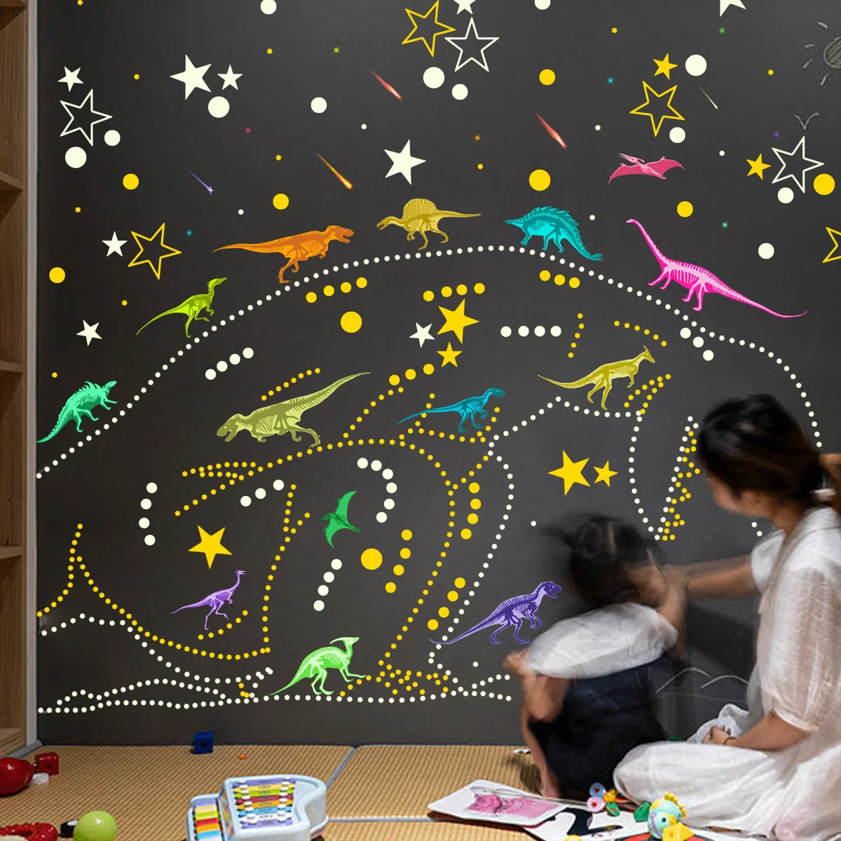 Glow-in-the-Dark Dinosaur Wall Stickers for Kids' Rooms displayed on a dark wall with various colorful dinosaur shapes.