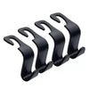 A pack of four black car headrest hooks designed for bag storage.
