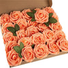 A box filled with realistic orange foam rose artificial flowers with green leaves.