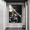 A framed art print depicting Lionel Messi celebrating with his jersey in a dark, dramatic setting.