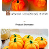 A display of bright orange decorative LED pumpkins used as a luminous night light.