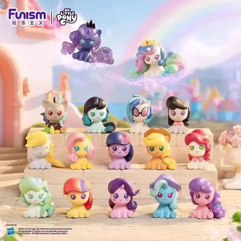 A collection of My Little Pony figurines in various colors and styles displayed on a wooden surface.