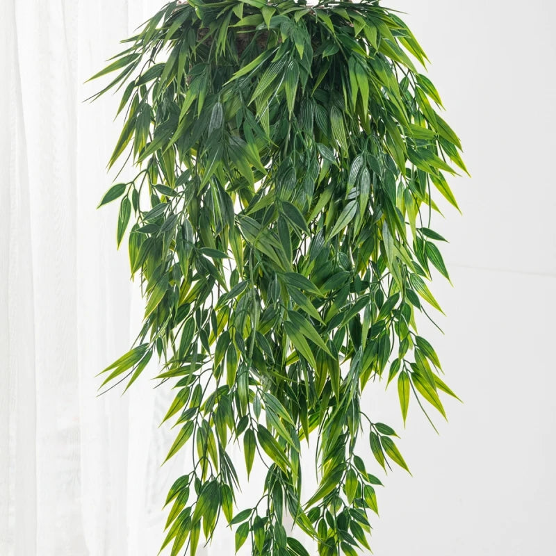 A lush green artificial ivy vine hanging down, used for home and garden decoration.