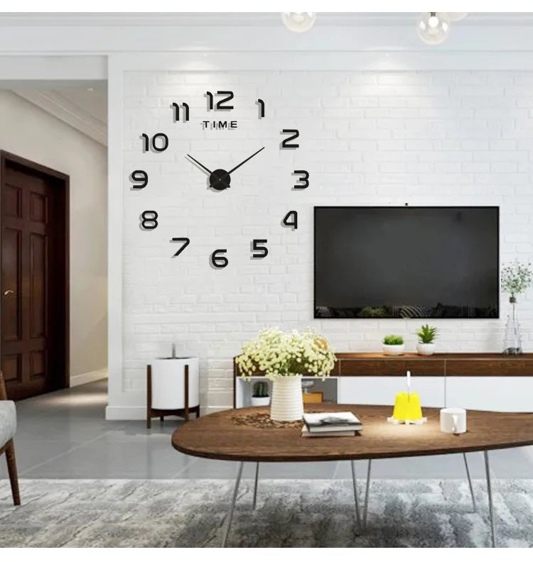 A giant black acrylic wall clock with Roman numerals and hands is mounted on a white brick wall above a wooden console table.