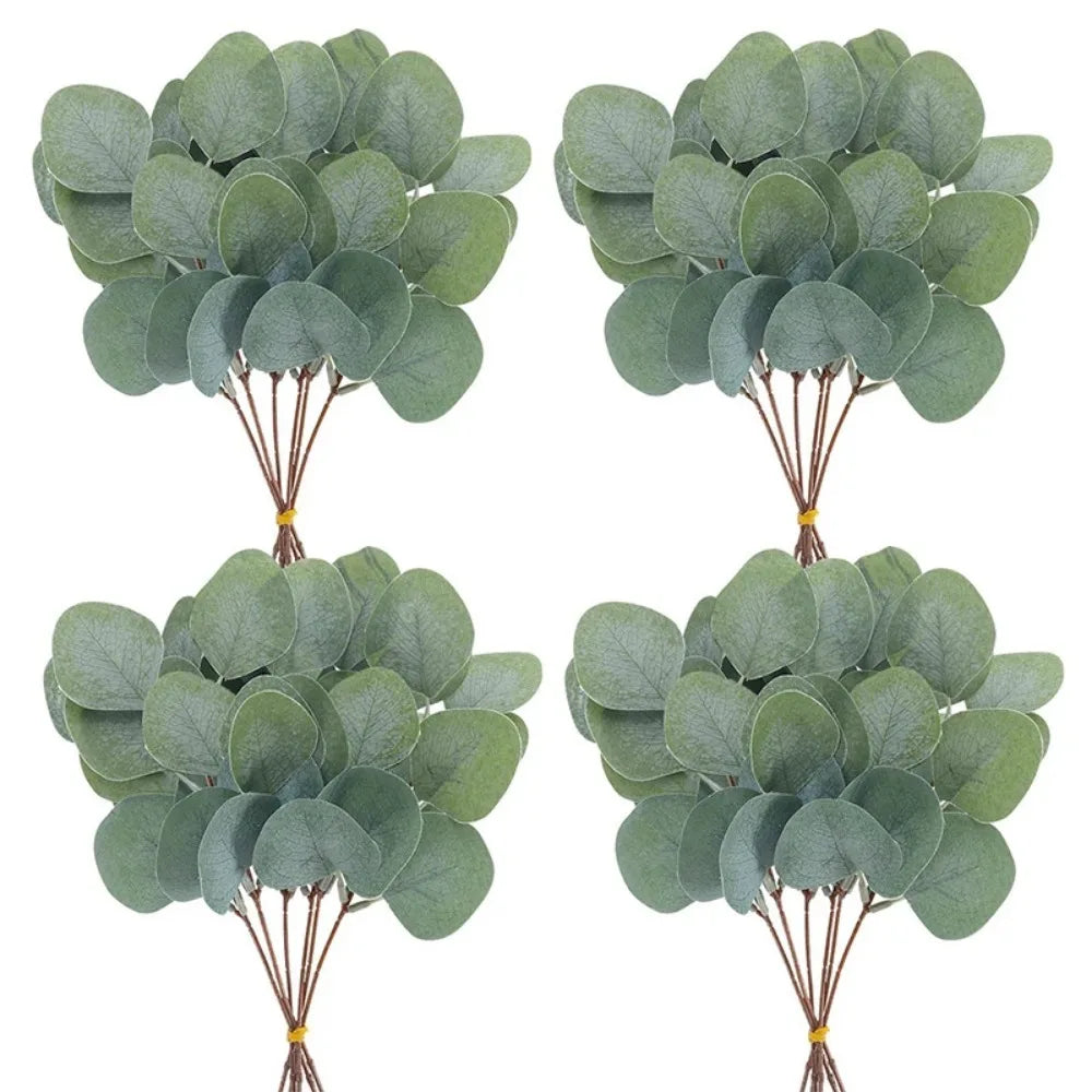 Four clusters of green eucalyptus leaves on brown stems for vase decor and wedding arrangements