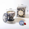 A gift set of soy wax aromatherapy candles in a decorative tin box and glass holder.