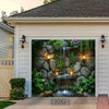 A decorative wall hanging featuring a stone waterfall and lush greenery set within a white frame.