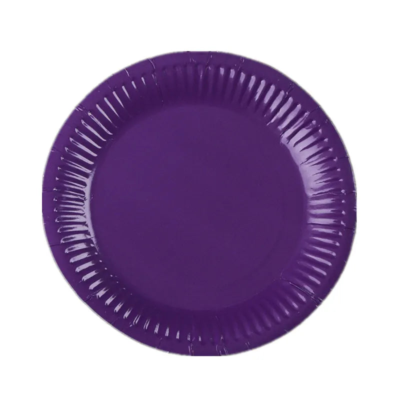 A purple disposable plate with ruffled edges.